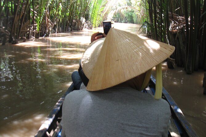 Private Mekong Delta Shore Excursions from Cruise Port - Ben Tre from the water: canals lined with coconut trees