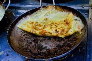 Private Street Food Evening Walking Tour in Ho Chi Minh City - Getting out of the tourist core: taxi first, then street-walking