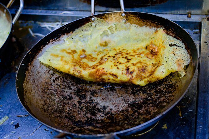 Private Street Food Evening Walking Tour in Ho Chi Minh City - Getting out of the tourist core: taxi first, then street-walking