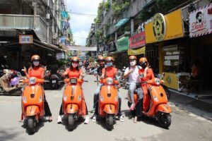 The Insider's Saigon With Female Ao Dai Riders Vespa 4,5 Hours - Cholon and Markets: Ho Thi Ky Flowers, Binh Tay Market, Thien Hau Pagoda